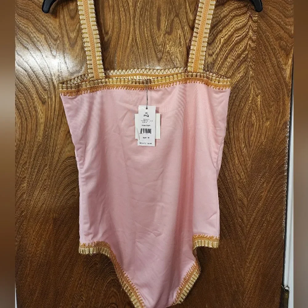 Platinum inspired by Solange FerrariniBuy Crochet Trim One Piece Swimsuit NWT